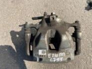 Суппорт тормозной Toyota Corolla E210 OEM 47750-02210 правый передний вид спереди на стеллаже